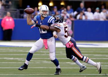 Indianapolis Colts quarterback Andrew Luck, left, is hit by Chicago Bears inside linebacker Jerrell Freeman on Sunday, Oct. 9, 2016, during the second half of an NFL game in Indianapolis.