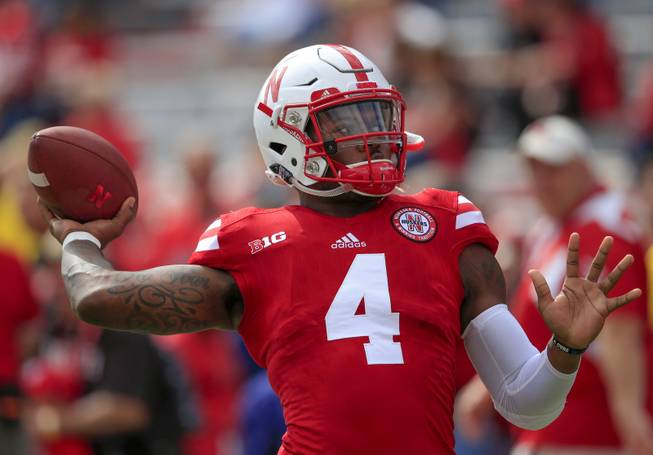 Nebraska quarterback Tommy Armstrong Jr. (4) warms up before an NCAA college football game against Illinois in Lincoln, Neb., Saturday, Oct. 1, 2016. 
