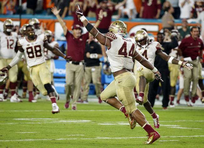 Florida State defensive end DeMarcus Walker (44) celebrates after blocking a field goal during the second half of an NCAA college football game against Miami, Saturday, Oct. 8, 2016, in Miami Gardens. Florida State defeated Miami 201-19. 