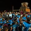Basic's Patrick Lustin (1) hosts the winning trophy as his team gathers after beating Green Valley during the Henderson Bowl football game on Friday, Oct. 14, 2016.