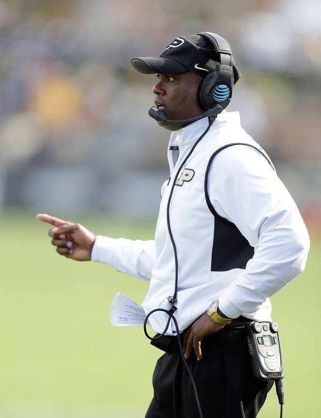 Purdue head coach Darrell Hazell calls a play Saturday, Oct. 15, 2016, during the second half of an NCAA college football game against Iowa in West Lafayette, Ind. Iowa won 49-35.