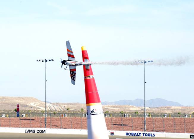 Red Bull Air Race World Championships in Las Vegas attempted to continue dispite being plagued by high winds during the final day of competition at the Las Vegas Motor Speedway.  Here Juan Velarde of Spain rounds a leaning pylon and has to cut his run short due to wind gusts during the Master Class Series competition. Sunday,October 16, 2016.