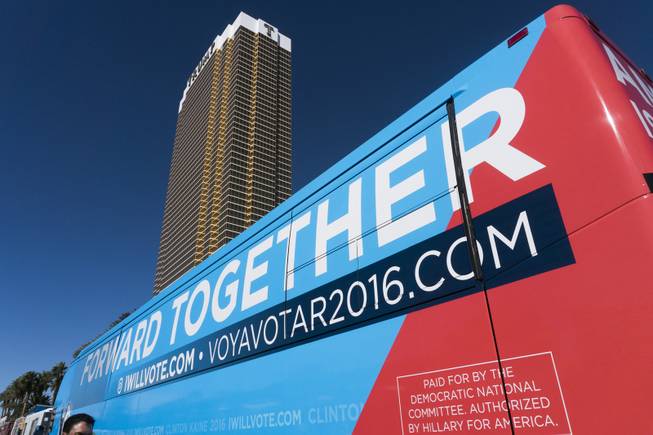 The Hillary Clinton campaign bus is parked in line behind the taco trucks during a "Taco-Truck-Wall" Culinary Union Local 226 protest at Trump International, Wednesday, Oct. 19, 2016.