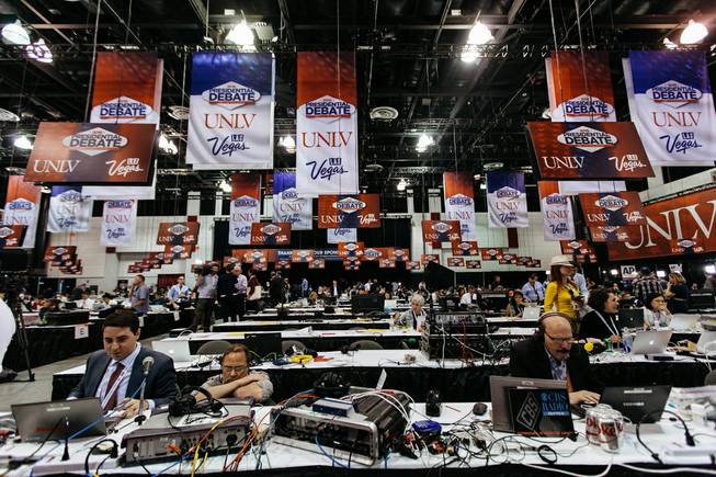 Members of the media work inside the spin room at the Thomas & Mack Center in Las Vegas before the third and final presidential debate on Wednesday, Oct. 19, 2016.