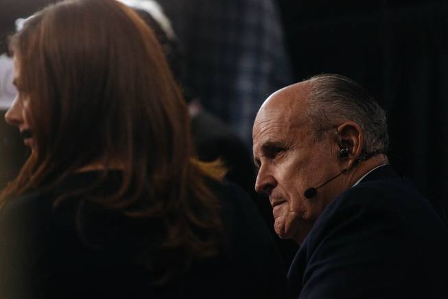 Former New York City Mayor Rudy Giuliani speaks on CNN during a live segment inside the spin room at Thomas and Mack Center in Las Vegas, Nev. prior to the third presidential debate on Oct. 17, 2016.