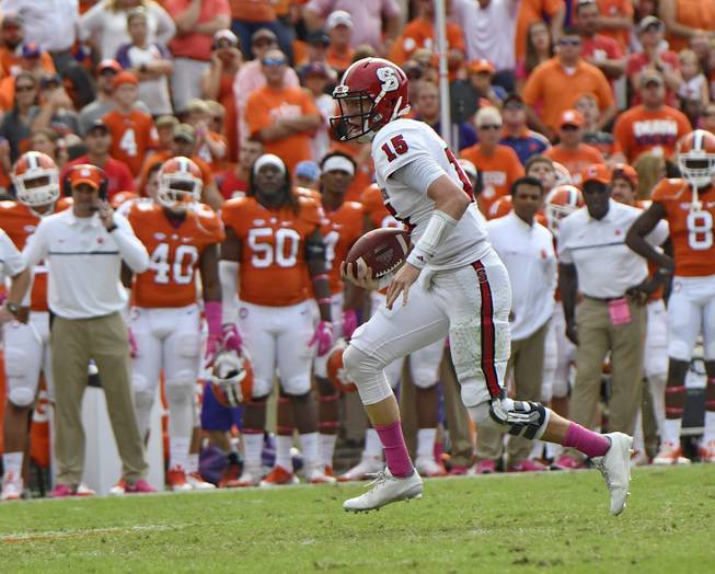 North Carolina State quarterback Ryan Finley scrambles out of the pocket for a first down during the second half of an NCAA college football game against Clemson Saturday, Oct. 15, 2016, in Clemson, S.C. Clemson won 24-17 in overtime. 