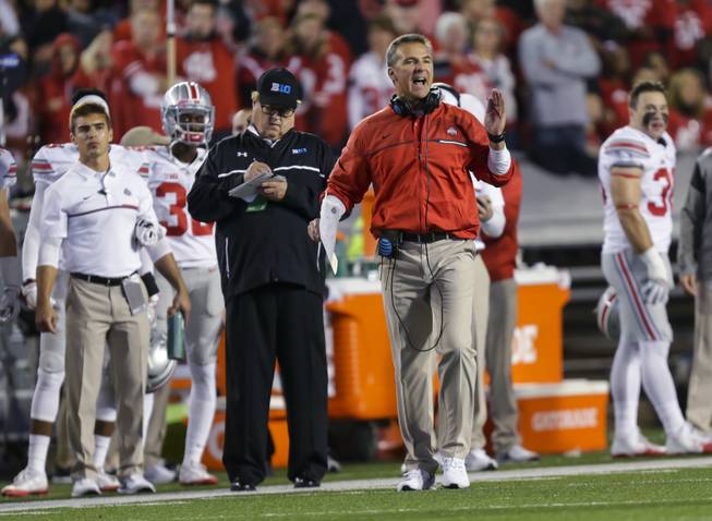Ohio State coach Urban Meyer disputes a call during the first half of the team's NCAA college football game against Wisconsin on Saturday, Oct. 15, 2016, in Madison, Wis. 