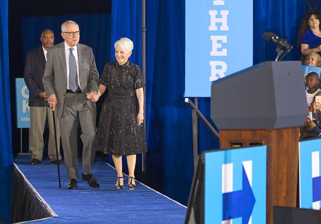 Senate Minority Leader Harry Reid (D-Nev.) and his wife Landra arrive for a rally with President Barack Obama at Cheyenne High School in North Las Vegas Sunday, Oct. 23, 2016.