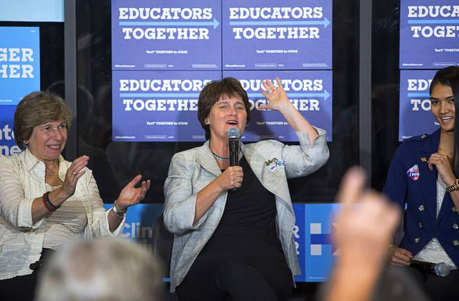 Anne Holton, center, wife of Democratic Vice Presidential candidate Tim Kaine encourages people to vote during an Education roundtable discussion at Nevada State College in Henderson Tuesday, Oct. 25, 2016.