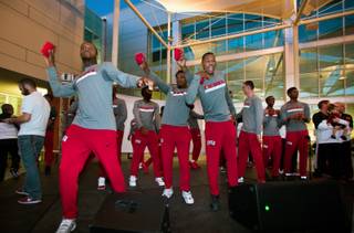 UNLV men's basketball players toss t-shirts to the crowd during The Runnin Rebel Rally, a student-centric event featuring both men and women's teams, entertainment, live music, cheer and food at the Student Union Courtyard on Wednesday, Oct. 26, 2016.