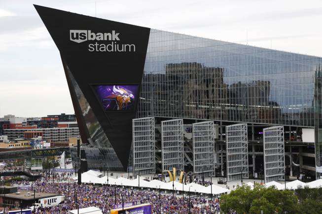 Fans arrive at U.S. Bank Stadium before an NFL football game between the Minnesota Vikings and the Green Bay Packers Sunday, Sept. 18, 2016, in Minneapolis.