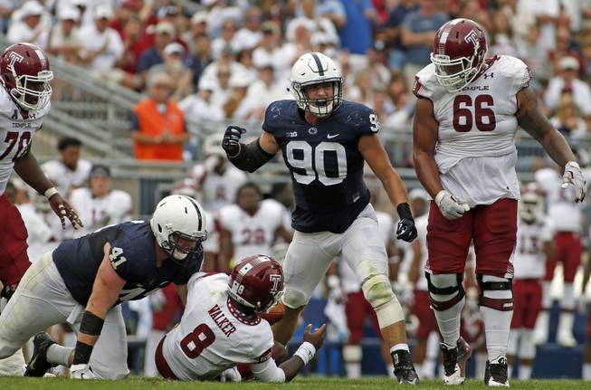 Penn State's Garrett Sickels (90) reacts after sacking Temple quarterback Phillip Walker (8) during the second half of an NCAA college football game in State College, Pa., Saturday, Sept. 17, 2016. Penn State won the game 34-27.