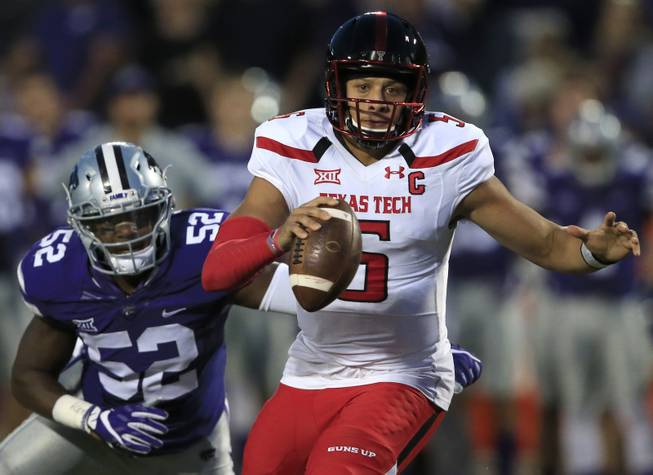 Texas Tech quarterback Patrick Mahomes II (5) runs for a touchdown past Kansas State linebacker Charmeachealle Moore (52) during the first half of an NCAA college football game in Manhattan, Kan., Saturday, Oct. 8, 2016. 