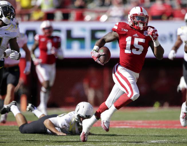 In this Sept. 17, 2016, file photo, Nebraska wide receiver De'Mornay Pierson-El (15) runs past a tackle attempt by Oregon defensive back Jaren Zadlo (38) during the first half of an NCAA college football game in Lincoln, Neb. Nebraska's dynamic return man and receiver, is looking more like his old self since coming back from a devastating knee injury. The Cornhuskers would love for him to have a breakout game this week against Wisconsin. 