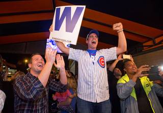 Chicago Cubs fans John Schumacher, left, and Andre Vieyra celebrate at Brando's Sports Bar, 3725 Blue Diamond Rd., after the Cubs beat the Cleveland Indians in Game 7 of the World Series Wednesday, Nov. 2, 2016.