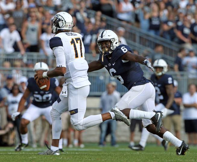 Penn State's Malik Golden (6) chases down Kent State quarterback Mylik Mitchell (17) during the first half of an NCAA college football game in State College, Pa., Saturday, Sept. 3, 2016. Penn State won 33-13.