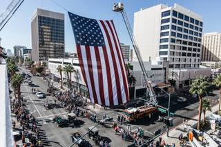 A crowd gathers to watch floats and participants in the Veterans Day parade in Downtown Las Vegas, Nev. on Nov. 11, 2016.