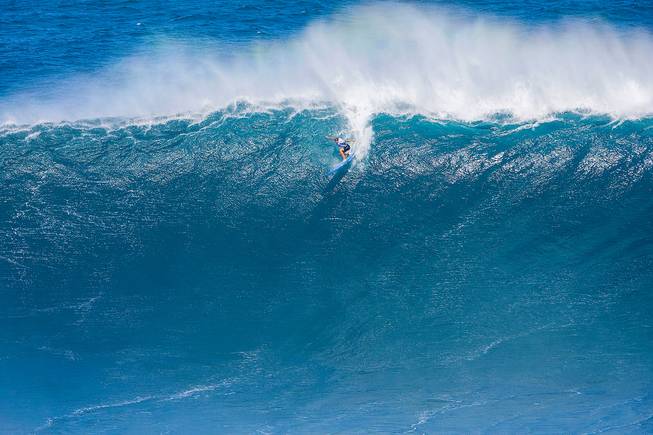 Emi Erickson surfs a Maui surf break known as "Jaws" on Friday, Nov. 11, 2016, in Haiku, Hawaii. Erickson is part of a group of women who made history Friday as they competed for the first time in the World Surf League's big-wave surfing competition.