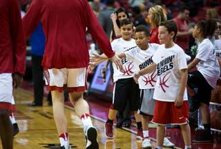 Young UNLV fans get some love from players as they ready to face UC Riverside at the Thomas & Mack Center on Wednesday, Nov. 16, 2016.