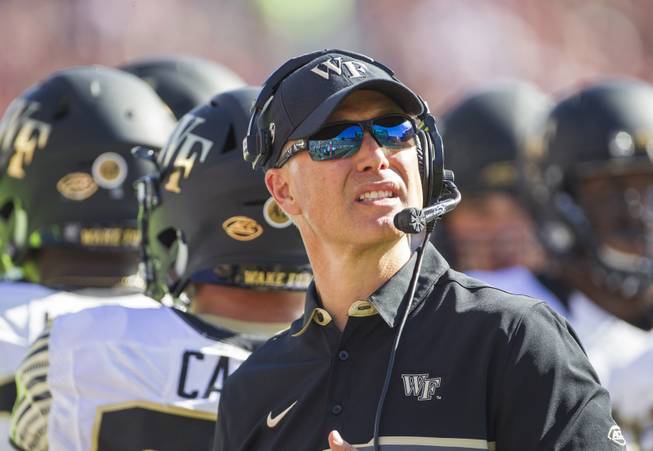 Wake Forest head coach Dave Clawson looks at the scoreboard in the first half of an NCAA college football game against Florida State in Tallahassee, Fla., Saturday, Oct. 15, 2016. 