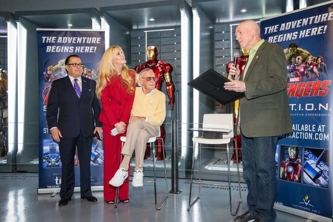 County Commissioner Larry Brown presents Marvel Comics legend Stan Lee (with daughter J.C. Lee and publicist Jerry Olivarez) with the "Key to The Strip" and the official proclamation of "Stan Lee Day" at Marvel's Avengers S.T.A.T.I.O.N. during a promo for Lee's "Respect" lapel pin, signifying unity among Americans, Friday Nov. 18, 2016.