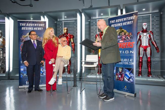 County Commissioner Larry Brown presents Marvel Comics legend Stan Lee (with daughter J.C. Lee and publicist Jerry Olivarez) with the "Key to The Strip" and the official proclamation of "Stan Lee Day" at Marvel's Avengers S.T.A.T.I.O.N. during a promo for Lee's "Respect" lapel pin, signifying unity among Americans, Friday Nov. 18, 2016.