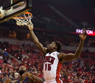 UNLV forward Dwayne Morgan (15) ensures that a basket counts over Cal State Fullerton during their game at the Thomas & Mack Center on Saturday, Nov. 19, 2016.