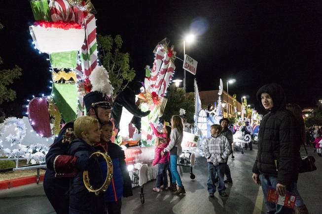 Costumed characters greet the crowd during the Downtown Summerlin Holiday Parade which included the tree lighting celebration, Friday, Nov. 18, 2016.