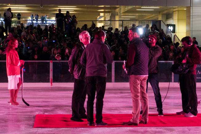 Las Vegas NHL team owner Bill Foley, center left, addresses questions about the team name during the Downtown Summerlin Holiday Parade which included the tree lighting celebration, Friday, Nov. 18, 2016.