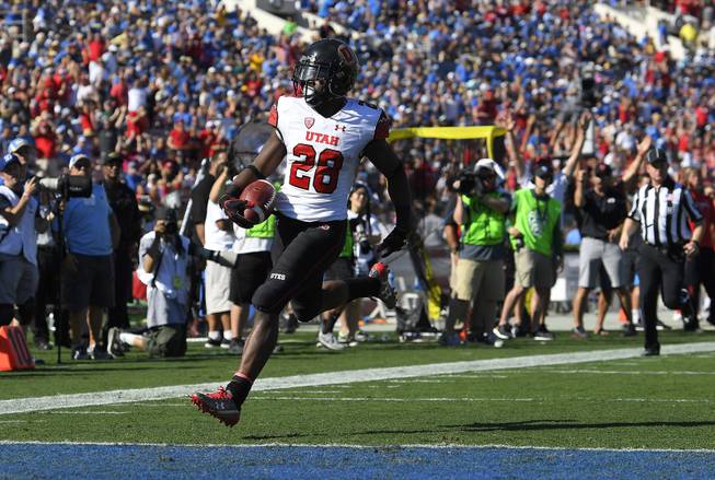 Utah running back Joe Williams runs in for a touchdown during the first half of an NCAA college football game against UCLA, Saturday, Oct. 22, 2016, in Pasadena, Calif. 