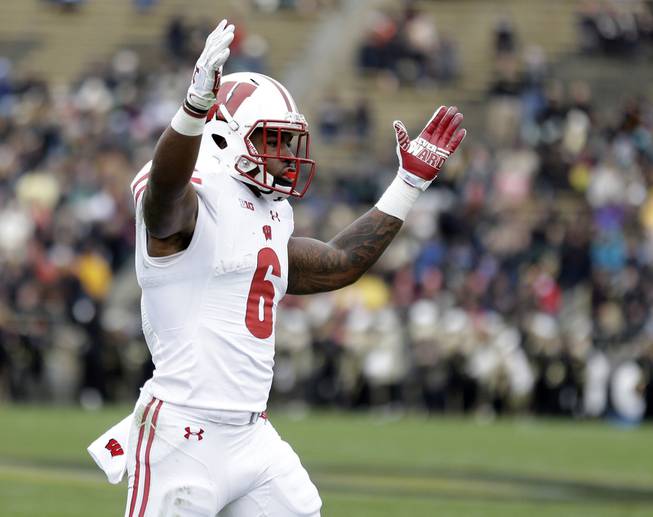 Wisconsin running back Corey Clement (6) celebrates a touchdown by fullback Alec Ingold during the first half of an NCAA college football game against the Purdue in West Lafayette, Ind., Saturday, Nov. 19, 2016. 