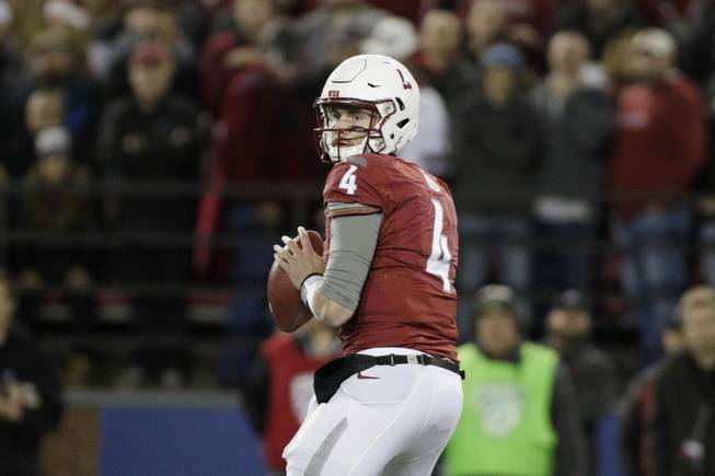 Washington State quarterback Luke Falk (4) looks to pass during the first half of an NCAA college football game against California in Pullman, Wash., Saturday, Nov. 12, 2016. 