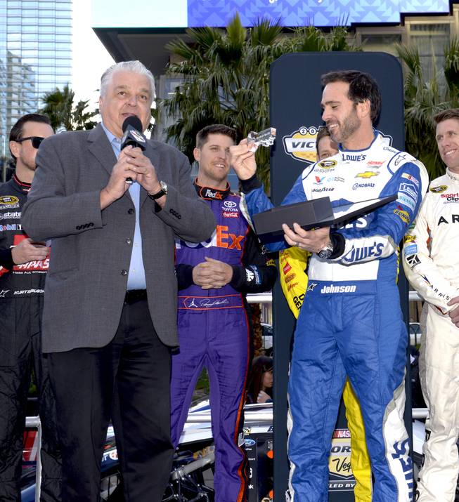 Clark County Commissioner Steve Sisolak presents Jimmie Johnson with the Key to the Strip as  NASCARs Sprint Cup Series Champions shut down the Las Vegas Strip on Dec. 1 to take a victory lap and do burnouts on the famed boulevard as part of Champions Week in Las Vegas. Thursday, December 1, 2016.