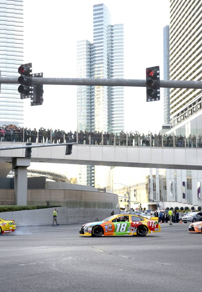 Kyle Busch joins the other NASCAR drivers as NASCARs Sprint Cup Series Champions shut down the Las Vegas Strip on Dec. 1 to take a victory lap and do burnouts on the famed boulevard as part of Champions Week in Las Vegas. Thursday, December 1, 2016.