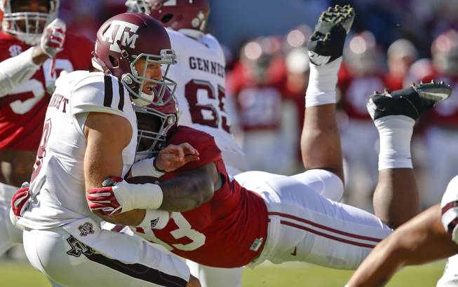 Alabama defensive lineman Jonathan Allen (93) sacks Texas A&M quarterback Trevor Knight, front left, during the first half of an NCAA college football game, Saturday, Oct. 22, 2016, in Tuscaloosa, Ala. 