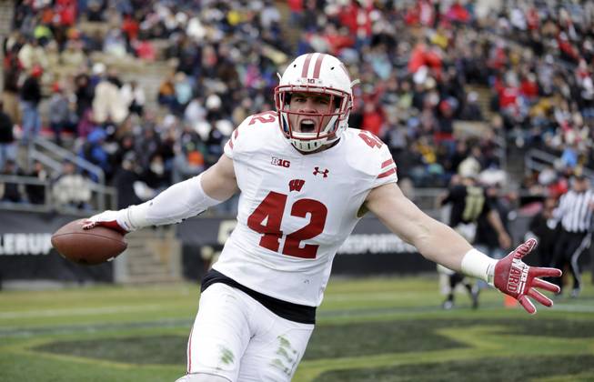 Wisconsin linebacker T.J. Watt (42) celebrates after returning an interception for a touchdown during the first half of an NCAA college football game against the Purdue in West Lafayette, Ind., Saturday, Nov. 19, 2016.