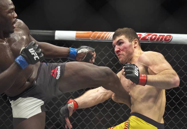 Light heavyweight Jared Cannonier connects with a kick to the ribs of Ion Cutelaba during their Ultimate Fighter 24 Finale fight at The Palms on Saturday, Dec. 3, 2016.  L.E. Baskow.