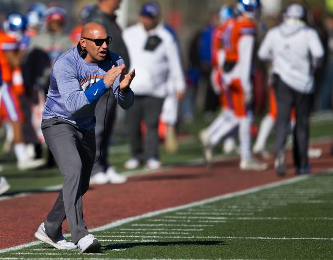 Bishop Gorman head coach Kenny Sanchez applauds his players as they score again over Liberty during their high school football state championship game at Sam Boyd Stadium on Saturday, Dec. 3, 2016.