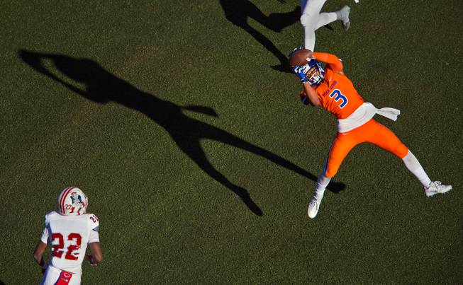 Bishop Gorman's Jalen Nailor (3) extends for another touchdown catch over Liberty during their high school football state championship game at Sam Boyd Stadium on Saturday, Dec. 3, 2016.
