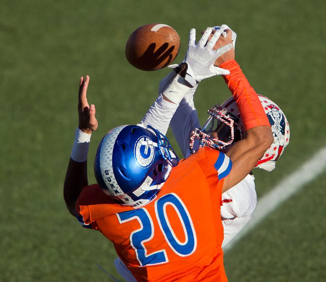 Bishop Gorman's Greg Oliver (20) breaks up a long pass intended for Liberty's Marquez Powell (1) during their high school football state championship game at Sam Boyd Stadium on Saturday, Dec. 3, 2016.