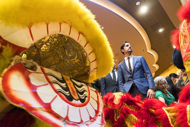 Lucky Dragons Chief Operating Officer David Jacoby is framed by dragon dance performers during Lucky Dragons grand opening celebration, Saturday, Dec. 3, 2016.