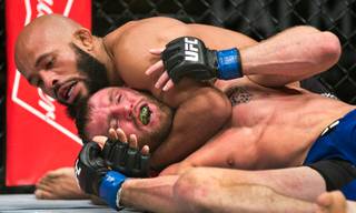 Flyweight title fighter Demetrious Johnson puts a choke hold on Timothy Elliot during their Ultimate Fighter 24 Finale fight at The Palms on Saturday, Dec. 3, 2016.