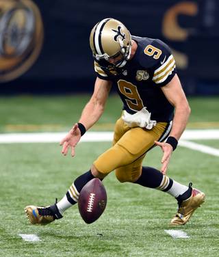 New Orleans Saints quarterback Drew Brees (9) chases down a bad snap in the first half of an NFL football game against the Detroit Lions in New Orleans, Sunday, Dec. 4, 2016. (AP Photo/Bill Feig)