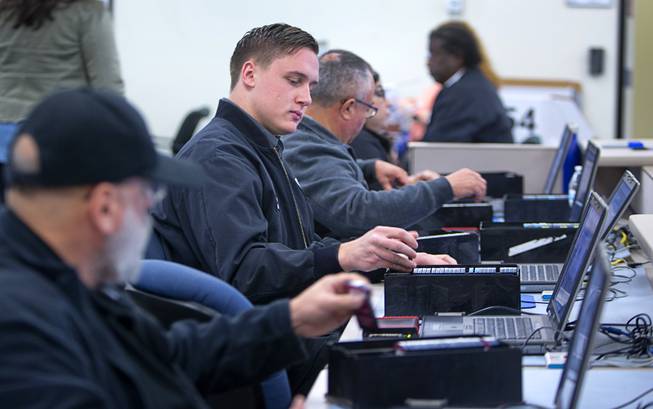 Clark County Election Department staff conduct an election recount of 84 precincts at a warehouse in North Las Vegas Monday, Dec. 5, 2016. The recount was requested and is being paid for by former presidential candidate Roque "Rocky" De La Fuente, a California businessman.