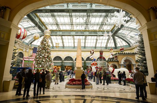 The annual holiday display is unveiled at the Bellagio Conservatory and Botanical Gardens in Las Vegas on Monday, Dec. 5, 2016. The Bellagio horticulture staff has assembled this year's display with 34,000 flowers, 750 plants and shrubs, and 25 trees to transform the 14,000-square-foot floral playground into a showcase of the distinctive sights and colors of the season.