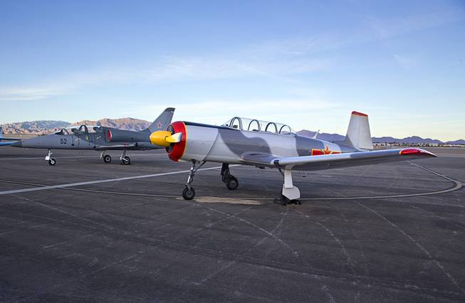 Vintage aircraft, a Aero L-39 Albatros, left, and a Chinese Nanchang CJ-6A, are displayed during a ceremony celebrating the 75th anniversary of the North Las Vegas Airport Wednesday, Dec. 7, 2016. The airport, originally called Sky Haven Airport when it opened in 1941, will host an aviation open house on Saturday, Dec. 10, from 9 am. to 3 pm.