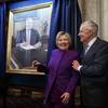 Former Secretary of State Hillary Clinton smiles with Reid during a ceremony to unveil a portrait of him on Capitol Hill on Dec. 8, 2016.