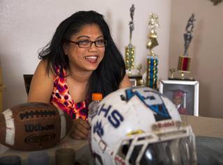 Regina Padua talks about her son Donnel Pumphrey during an interview at her home in North Las Vegas Tuesday, Dec. 13, 2016. Pumphrey, a graduate of Canyon Springs High School, needs 108 yards on Saturday to set the all-time record for most rushing yards in college football history.