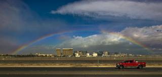 A rainbow arches over the Strip as wind and rain makes its way through the region on Friday, December 16, 2016.
