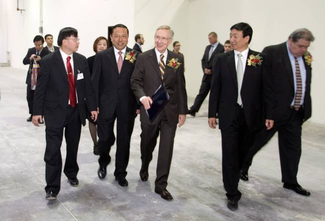 Senate Majority leader Harry Reid, center, arrives with Kai Huang, 2nd left, deputy mayor of Shenyang, China, Jinxiang Lu, 2nd right, Chairman/CEO of A-Power, and Tom Conway, right, international vice president of the United Steelworkers union, for the dedication of a new A-Power Energy Generation Systems manufacturing facility in Henderson Tuesday, October 12, 2010. A translator is at far left. The company, based in China, will produce wind turbines and LED lighting. STEVE MARCUS / LAS VEGAS SUN